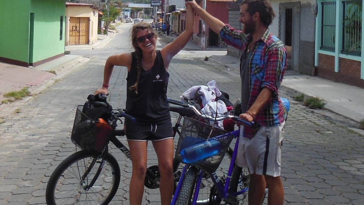 Stephi and friend with bikes in street