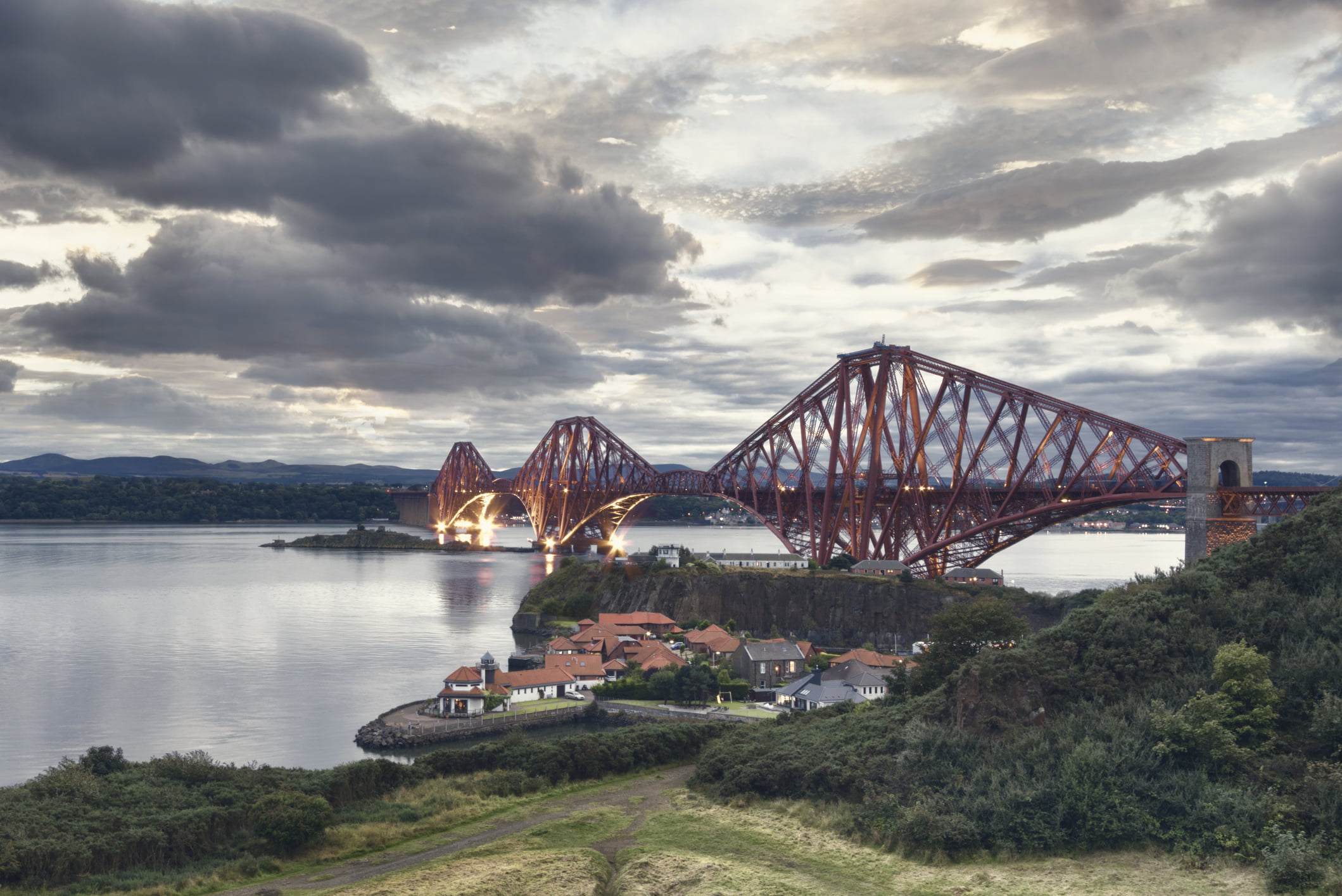 The Forth Bridge is a cantilever railway bridge across the Firth of Forth in the east of Scotland, 9 miles west of central Edinburgh. It is considered as a symbol of Scotland, and is a UNESCO World Heritage Site.