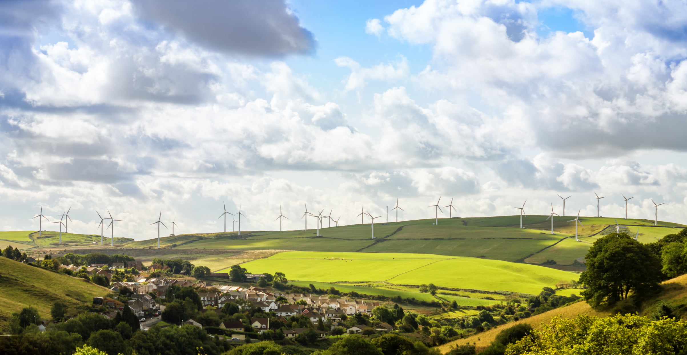 Long range view of wind turbines in the countryside