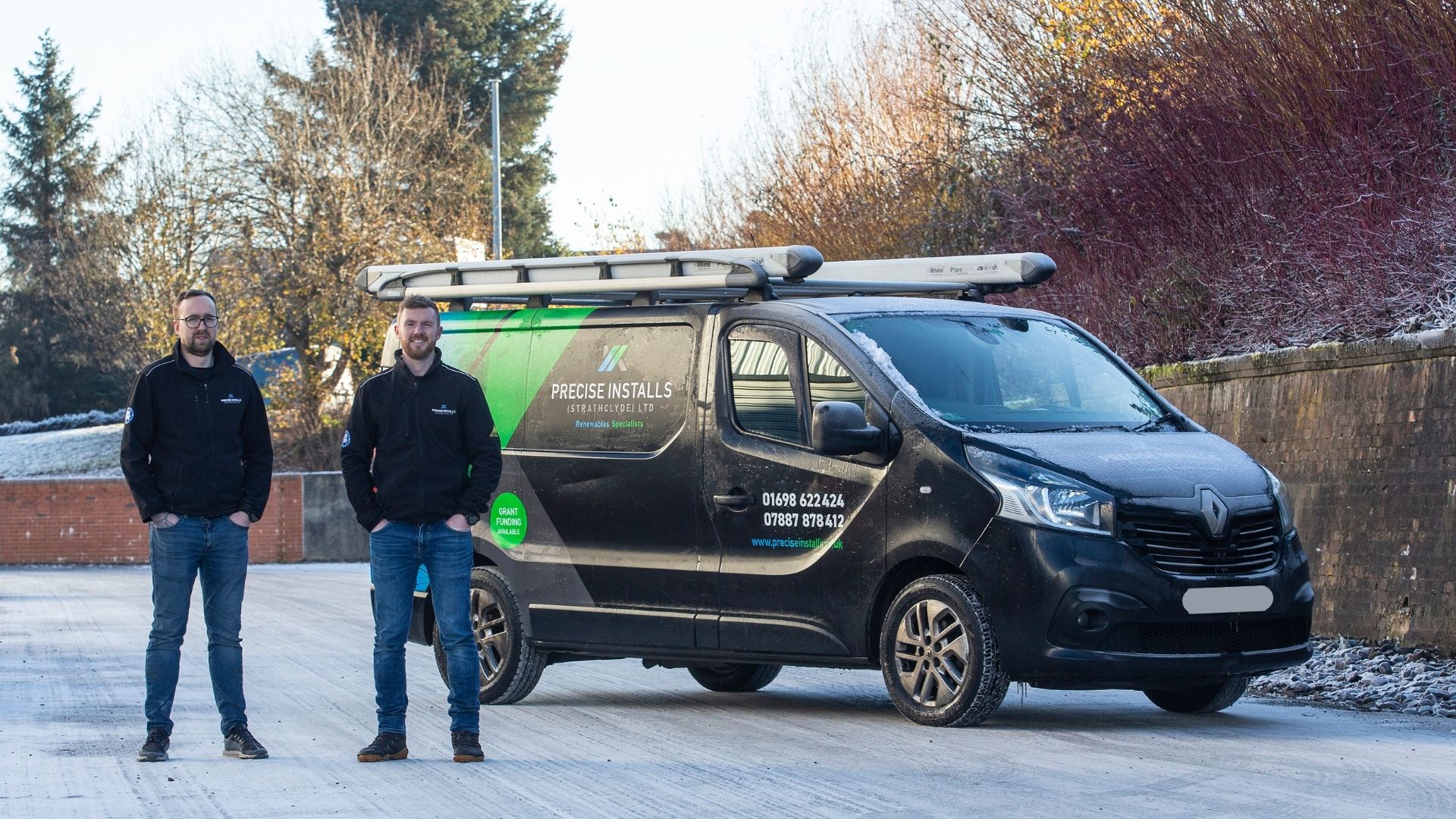 Scott and William standing in front of their Precise Installs van.