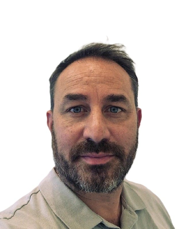 Head shot of Nick Harvey Senior Programme Manager Transport Decarbonisation. Dark haired man with a salt and pepper beard and moustache.