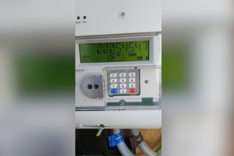 Close up of a smart electricity meter showin a reading and keypad.