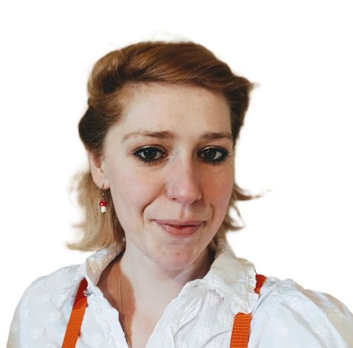 Portrait of a brown-haired woman wearing a white shirt.